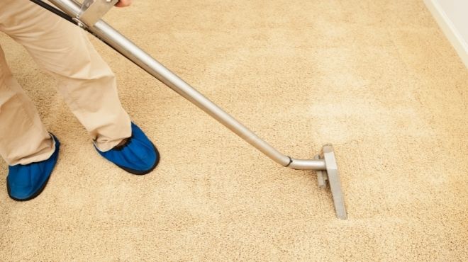 professional cleaning a carpet with a steam cleaning machine Oshawa 1